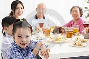 Asian family having dinnerÂ at home